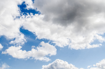 Obraz premium clouds in the blue sky / blue sky with cloud / Nice white cloud on the sky / blue sky background with tiny clouds / Sky clouds / Blue sky / white fluffy clouds in the blue sky 