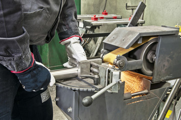 in a metal workshop - grinding
