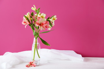 Beautiful alstroemeria flowers on a white wooden table