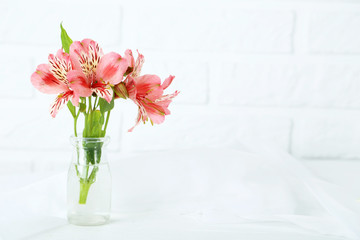 Beautiful alstroemeria flowers on a white wooden table