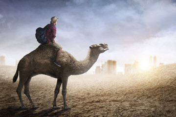 Image of traveler riding camel
