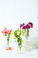 Beautiful alstroemeria flowers on a white wooden table