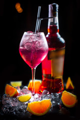Beautiful and original cold fruit smoothie with fresh oranges, lime and ice cubes