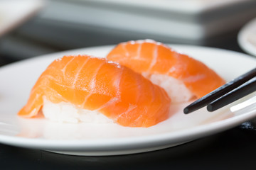 Sushi salmon on white plate
