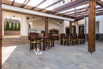 Beautiful terrace lounge with pergola and wooden table 