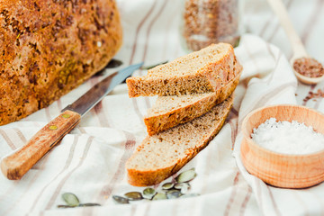 homemade rye bread unleavened with seeds, slices, selective focu