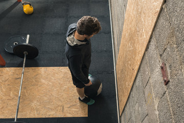 Male Crossfit Trainer doing Wall Ball
