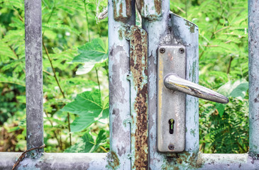 Old lock on blue rusty iron gate, Close up and selective focus
