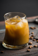 White russian cocktail on the wooden background