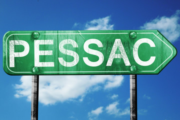pessac road sign, vintage green with clouds background