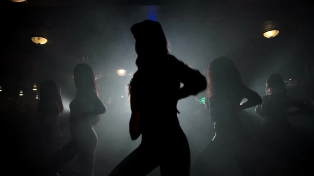 silhouettes of girls dancing 