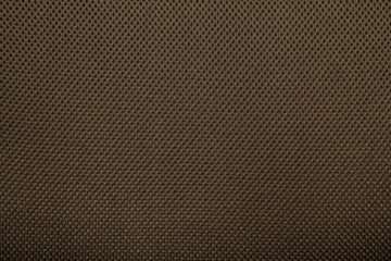 Brown fishnet cloth material as a texture background.