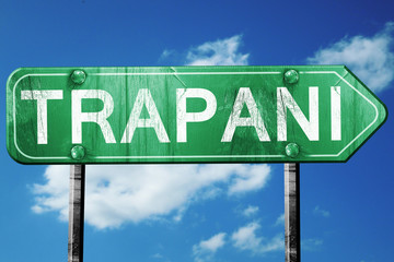 Trapani road sign, vintage green with clouds background
