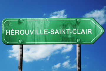 herouville-saint-clair road sign, vintage green with clouds bac