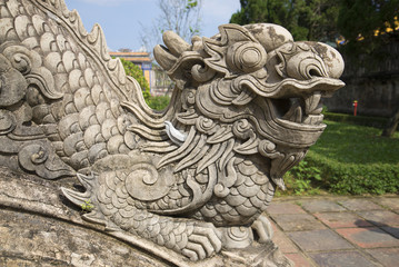 The sculpture of the dragon close up. A fragment of the porch of the Emperor's study in the forbidden city. Hue, Vietnam
