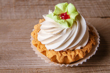 Pink cupcakes on wooden background