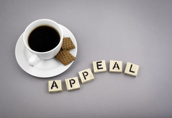 Text: Appeal from wooden letters on a gray background.