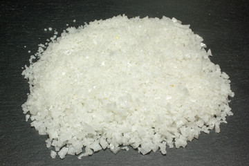 Large sea salt on dark background