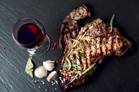 Steak With Spices And Glass Of Red Wine