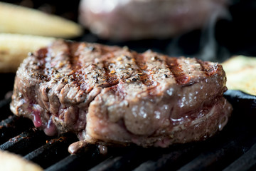 striped steak on a grill close up