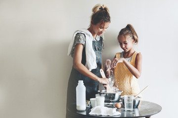 Mom baking with her daughter