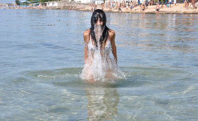 Girl emerging from sea