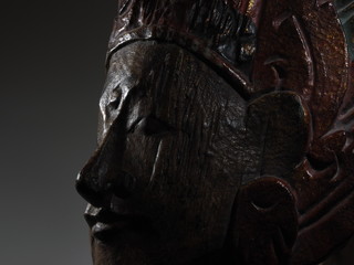 Buddha face profile carving low key