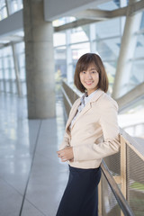 Fototapeta premium Attractive asian business woman smiling outside office