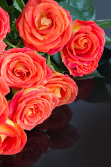 Bouquet of fresh red roses on black background. Valentines Day background. Wedding day.
