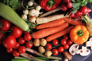 Fresh, raw, organic vegetables on black background. Cooking, Healthy eating concept. - obrazy, fototapety, plakaty