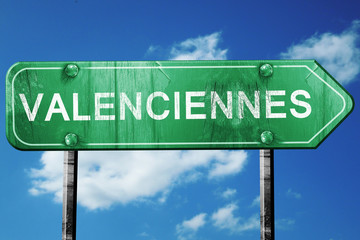 valenciennes road sign, vintage green with clouds background