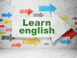 Education concept: arrow with Learn English on grunge wall background