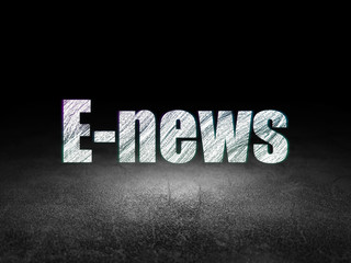 Naklejka premium News concept: E-news in grunge dark room