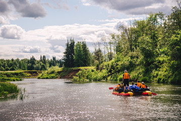 .Tourists raft on river