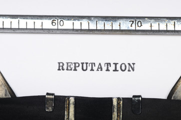 Word reputation typed on typewriter