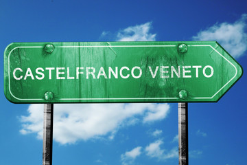 Castelfranco veneto road sign, vintage green with clouds backgro