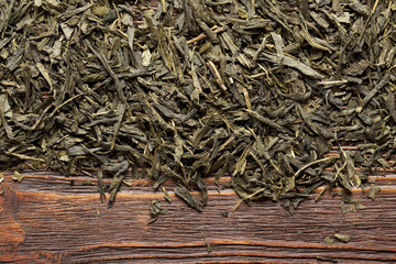 Dried tea leaves on wooden planks