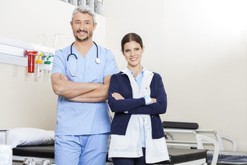 Obraz premium Physiotherapists Standing Arms Crossed In Rehab Center