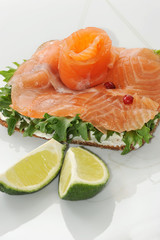 sandwiches of salmon with salad leaves