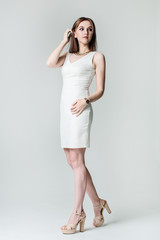 Beautiful caucasian woman on light grey background