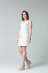 Beautiful caucasian woman on light grey background