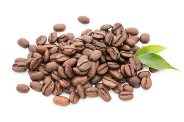 Coffee grains and leaves isolated on the white backgrounds.