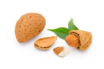 Almonds with leaves isolated on white background