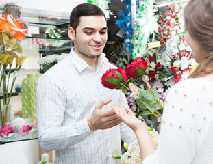 man and woman buying  flower