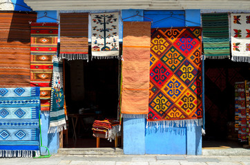 Wall of a local store with traditional Mexican handmade carpets 