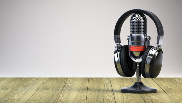 Microphone And Headphones On Wooden Table