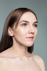 Fototapeta premium Beauty portrait of young model with middle length hair. Professional nude makeup. Green eyes.