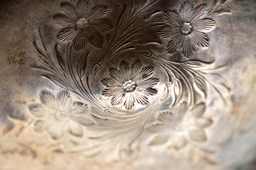 Tarnished silver carved flowers