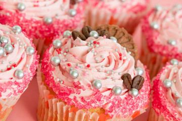 Closeup of pink cupcakes with sprinkles