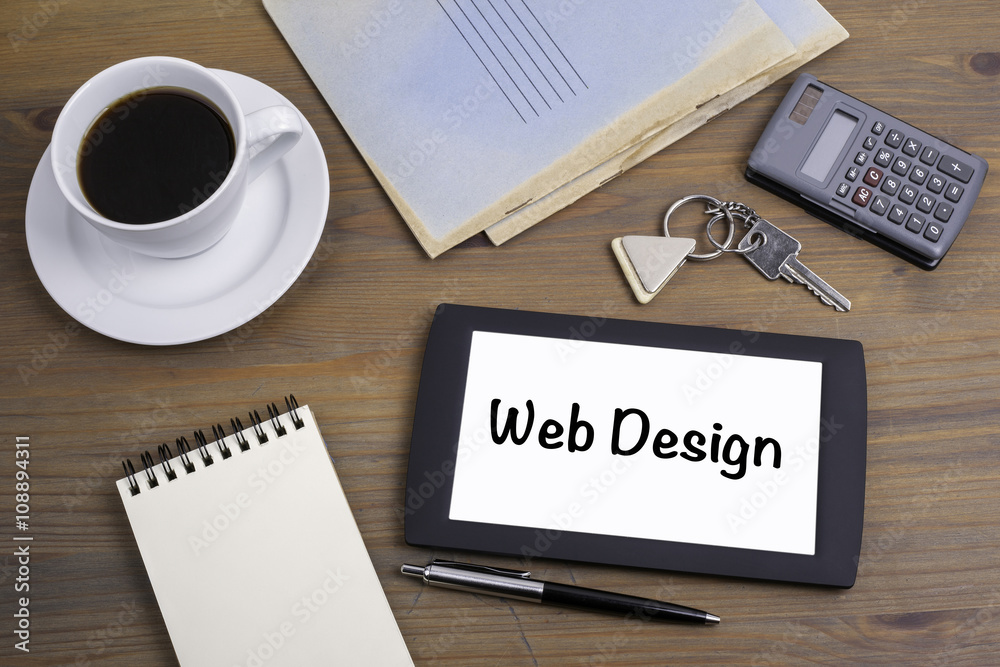 Wall mural web design. text on tablet device on a wooden table